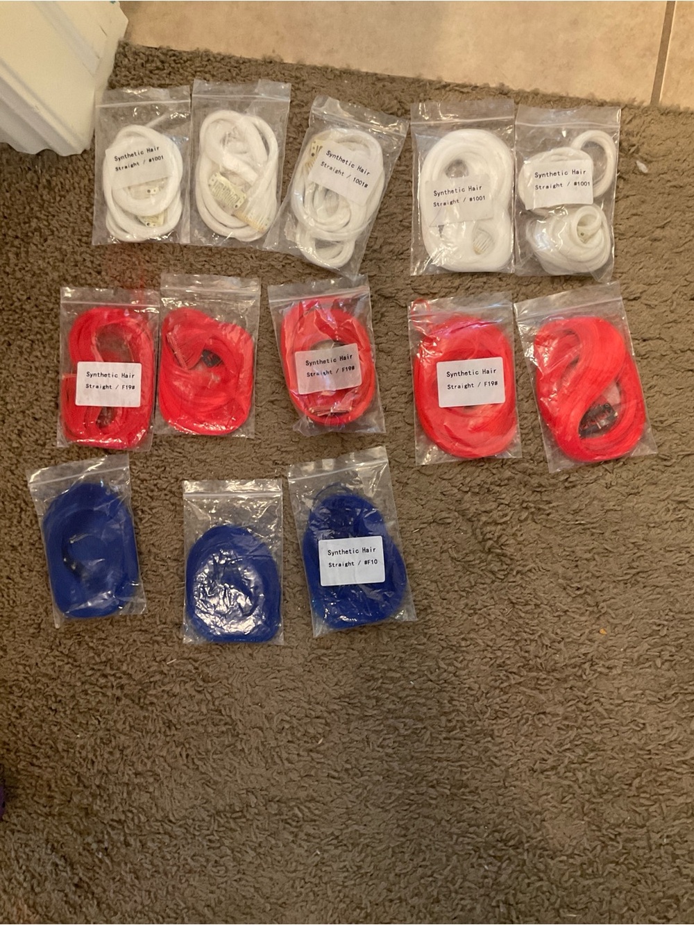 White, red, and blue clip on hair Extensions
